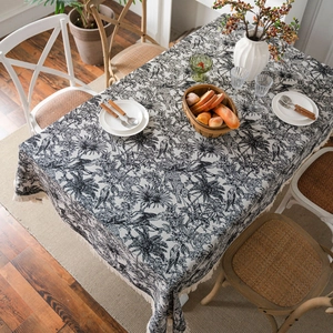 Black and white jacquard tablecloth with tropical palm trees and fringe tassels