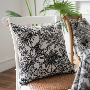 Square cotton linen cushion with black and white tropical rain forest and palm tree print