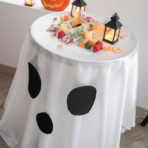 White ghost print Halloween tablecloth with pumpkin decor for festive party dining tables