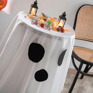 Ghost face Halloween party tablecloth with pumpkin and spider web decor for round tables