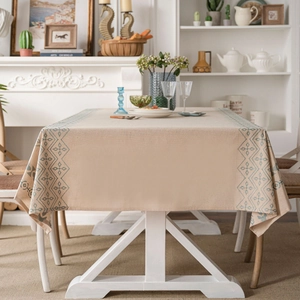 Minimalist linen rectangle tablecloth with blue geometric embroidery on the edges