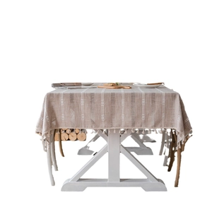 Brown boho tablecloth with embroidered stripes and elegant tassels for dining room decor