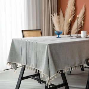 Gray rectangular tablecloth with fringe, striped embroidery, and cotton linen texture