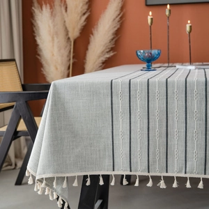 Gray striped linen tablecloth with embroidery and fringe tassels for dining table