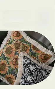 Detailed view of jacquard woven sunflower pattern cushion cover with creamy white tassels