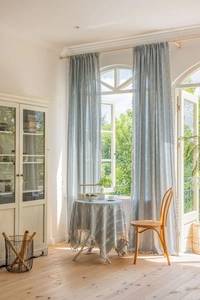 Light blue striped cotton linen curtains with tassel fringe detail and matching tablecloth