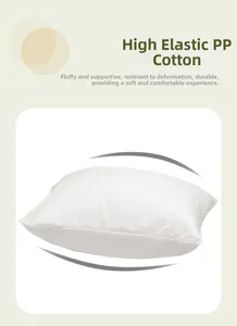 Close-up of fluffy PP cotton filling inside a white insert for throw pillows