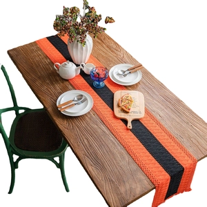 Halloween crochet hollow table runner in orange and black for festive dining decoration