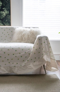 Detail of ruffled edge and lemon print on cream multifunctional sofa cover cloth