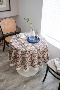 Close-up of thick jacquard tablecloth with geometric patterns and fringe edges
