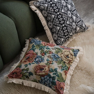Bohemian style throw pillow covers with geometric floral patterns and fringe edges