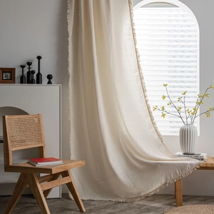 Cream waffle weave curtain with fringe trim for a minimalist nordic style home decor