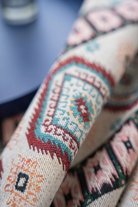 Detailed macro view of high-density jacquard fabric with geometric bohemian patterns