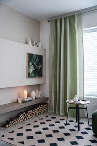 Detailed texture of green and white vertical striped linen blend blackout curtains