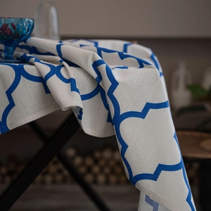 Blue geometric diamond print cotton linen tablecloth with Moroccan pattern on black table