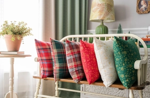 Detail view of six Christmas cushion covers with festive plaid and gold prints