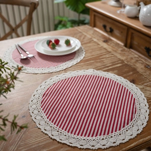 Set of two red striped cotton linen round placemats with delicate beige lace edges