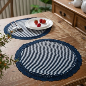 Classic blue and white striped fabric placemats with dark blue crochet lace borders