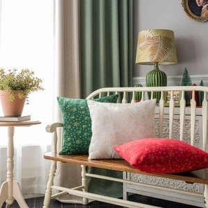 Christmas cushion covers in green and red with gold snowflake prints for sofa decor