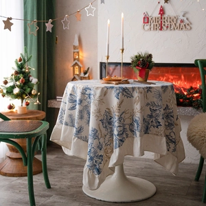 Christmas floral round tablecloth with ruffled edges and festive holiday decorations