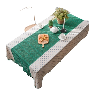 Blue daisy pattern tablecloth with green hollow-out lace runner and crochet fringe