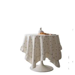 Elegant round lemon print tablecloth with decorative ruffle edge in cotton linen style