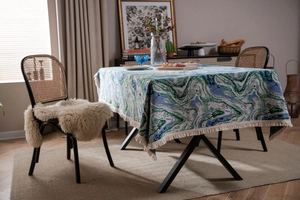 Close-up of thick jacquard tablecloth with green marble pattern and cream fringe edges