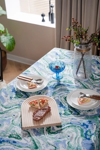 Detail of artistic green ink wash jacquard tablecloth with thick high-quality fabric texture