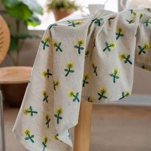 Floral embroidered cotton linen tablecloth in beige with yellow flower patterns
