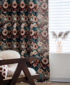 Close-up of vintage floral curtains with elegant tassel trim and premium jacquard texture