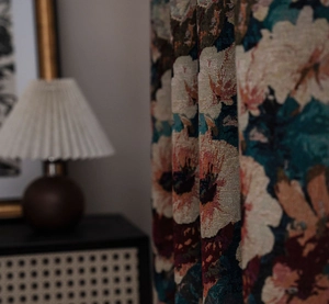 Detail of floral jacquard curtain fabric showing rich texture and vintage flower patterns