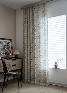Detailed view of boho style linen curtain with leaf print and delicate tassel ball trim