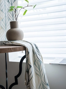 Detailed view of Nordic cotton linen curtain with vintage leaf print and tassel fringe
