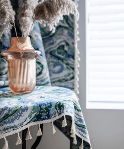 Detail of Nordic knit curtain with marble jacquard texture and elegant fringe tassels