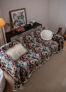 Top view of vintage floral jacquard sofa throw cover with elegant white tassel fringe edges