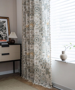 Detailed view of bohemian mandala printed cotton linen curtain with decorative tassels