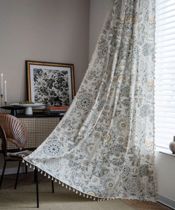 Detail of vintage bohemian pattern with beige tassels on cotton linen curtain fabric