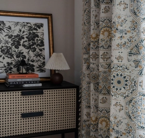 Detail of bohemian mandala print cotton linen curtain with decorative tassels