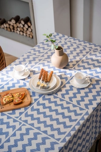 Detailed texture of American style geometric pattern tablecloth on a wooden dining table