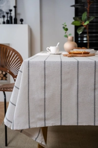 Detail view of woven striped table cloth fabric with high-quality linen texture finish
