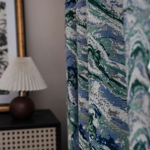 Semi-blackout curtain featuring blue and green abstract marble jacquard texture in home setting