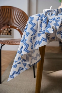Detail of blue geometric zigzag pattern on high-quality cotton linen tablecloth