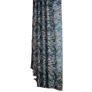 Artistic marble pattern jacquard curtain with tassels in teal and cream tones
