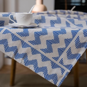 Vintage American style linen tablecloth with blue geometric print on beige fabric