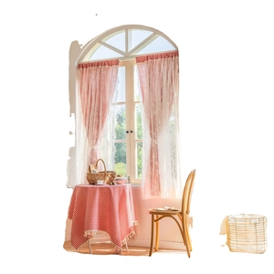 Red plaid curtains with white lace edges and matching tablecloth in cottage style