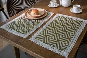 Detailed view of Nordic geometric jacquard table runner with delicate white lace edges