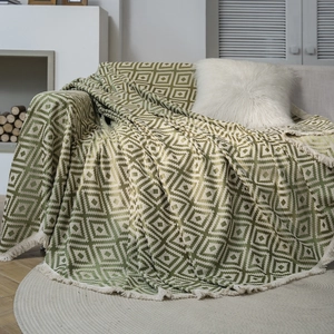 Green and white geometric jacquard knitted sofa throw blanket with stylish cream tassels