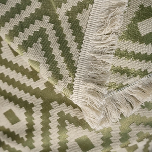 Green and cream geometric zigzag jacquard sofa throw blanket with decorative tassels