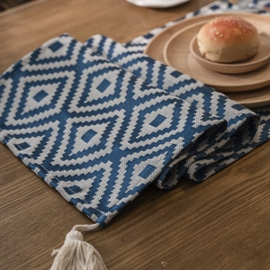 Nordic blue geometric jacquard table runner with decorative off-white tassels
