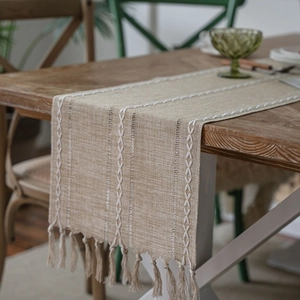Nordic jacquard table runner with geometric patterns and handcrafted fringe tassels